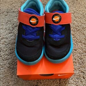 Nike Kids Black and Blue Sneakers with Orange Accents